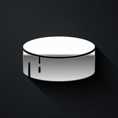 Silver Hockey puck icon isolated on black background. Sport equipment. Long shadow style. Vector Illustration.