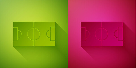 Paper cut Football or soccer field icon isolated on green and pink background. Paper art style. Vector Illustration.