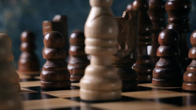 White and black pieces on chess board
