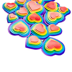 Lgbt festive valentine background - rainbow hearts isolated on white , border, top view.