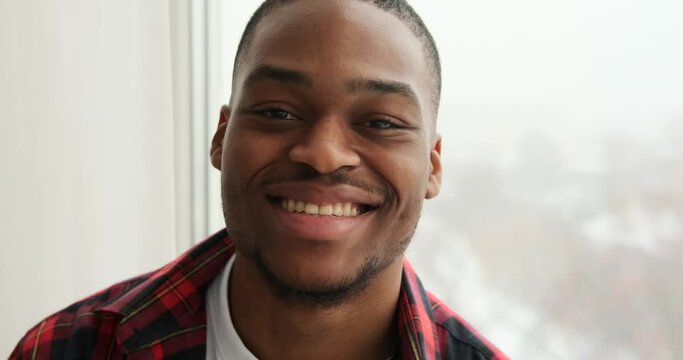 Confident african american man smiling at home