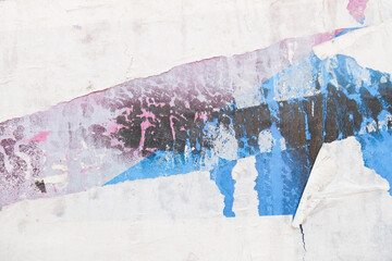 Old and torn street posters background. Abstract weathered texture.
