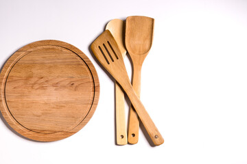 Cutting board and spatulas for cooking.