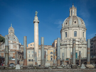 Fototapeta na wymiar A view of the old roman Trajan's Forum with Santissimo Nome di Maria al Foro di Traiano Church, Basilica Ulpia, Rome, Italy