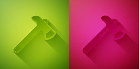 Paper cut Firefighter axe icon isolated on green and pink background. Fire axe. Paper art style. Vector.