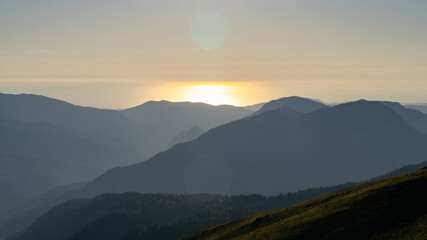 sunset in the mountains over the sea