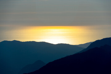 sunset in the mountains over the sea