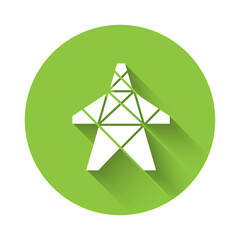 White Electric tower used to support an overhead power line icon isolated with long shadow. High voltage power pole line. Green circle button. Vector.