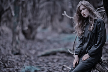 gloomy autumn park girl portrait, unusual toning autumn look model