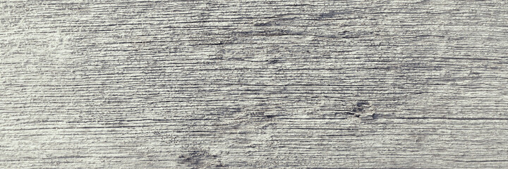 Old wood texture. Weathered rough gray surface of a dry wooden beam. Natural rustic background. Close-up.