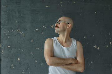 unusual portrait of a bald mustachioed young gentleman, eccentric mister, psychology concept