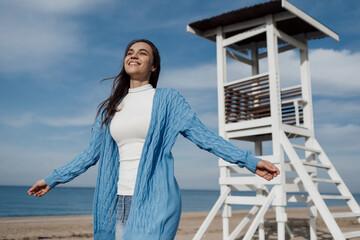 Happy young smiling woman outdoors. freedom and calm concept