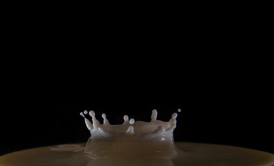milk splash on black background