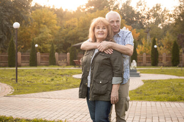 Senior couple in the park in spring or summer day, Valentines day