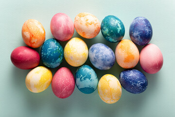 Fototapeta na wymiar Easter eggs on blue background, top view