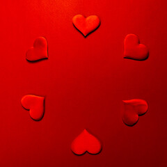 Red hearts on color background