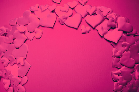 Pink hearts on purple background