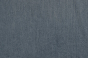 Blue-gray denim background with space for writing text.