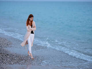 Woman on the beach near the ocean transparent water sweater model