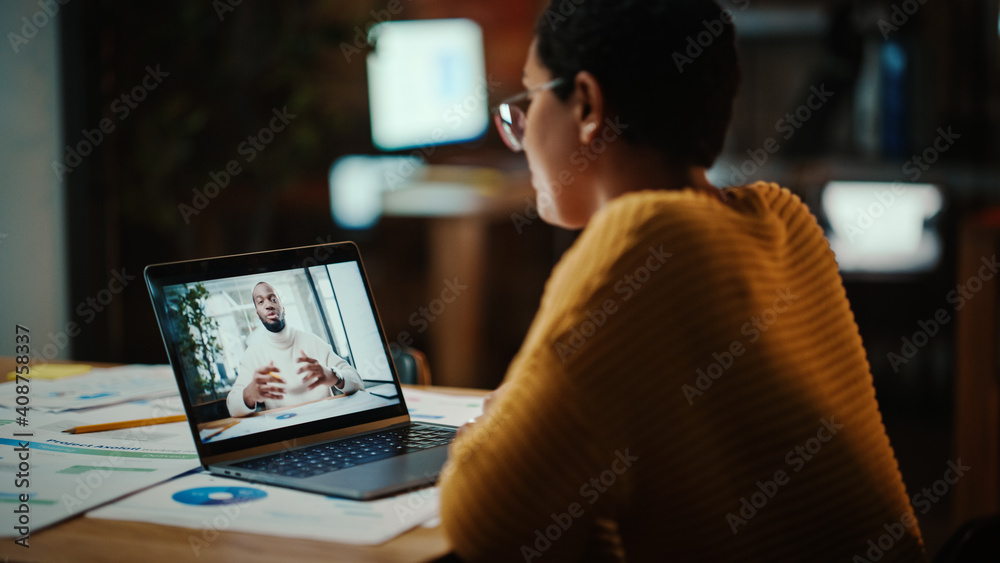 Poster Beautiful Multiethnic Latina Project Manager is Making a Video Call on Laptop Computer in Creative Office Environment. Female Specialist Talking to Black African American Colleague Over a Live Camera.