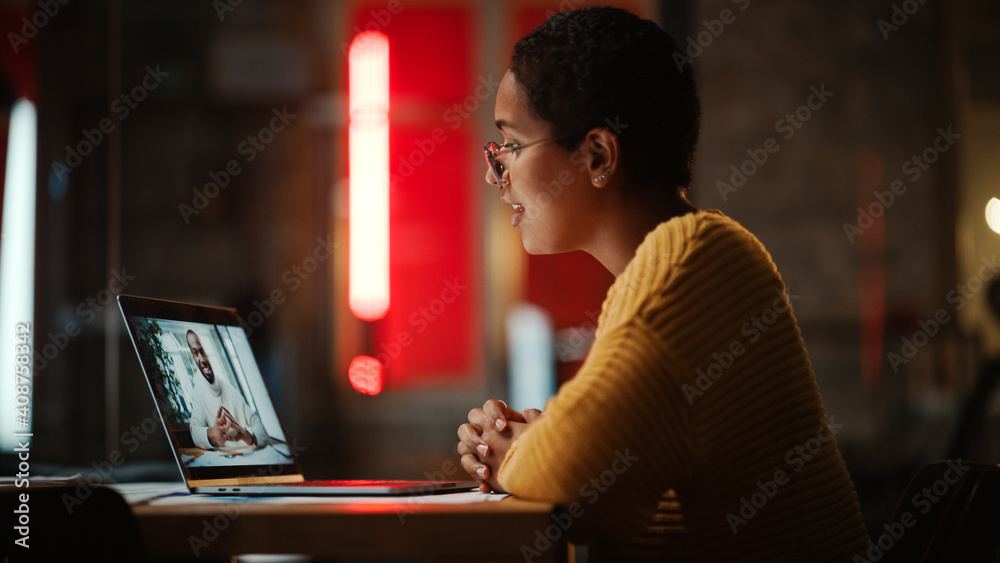 Aufkleber beautiful multiethnic latina project manager is making a video call on laptop computer in creative o