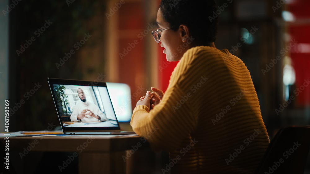 Poster Beautiful Multiethnic Latina Project Manager is Making a Video Call on Laptop Computer in Creative Office Environment. Female Specialist Talking to Black African American Colleague Over a Live Camera.