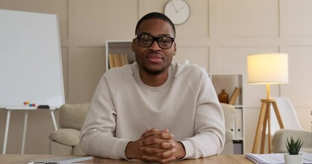 Man speaking on video call at office - Powered by Adobe