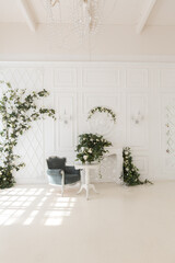 luxury delicate interior of the living room and bedroom in light colors with expensive chic carved furniture in classic style