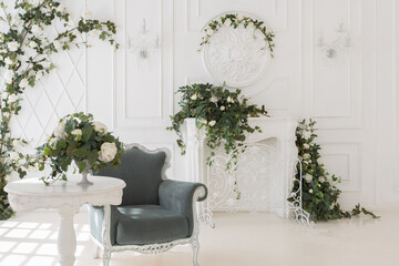 luxury delicate interior of the living room and bedroom in light colors with expensive chic carved furniture in classic style