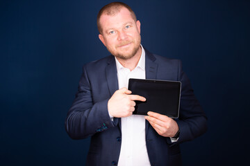 Businessman using tablet, double exposure with network