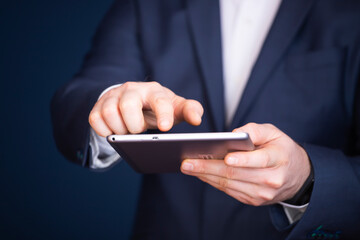 Businessman using tablet, double exposure with network