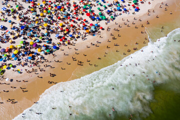 Aerial view of Copacabana beach with beach umbrellas and sun loungers . Rio de Janeiro, Brazil.