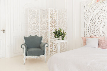 luxury delicate interior of the living room and bedroom in light colors with expensive chic carved furniture in classic style