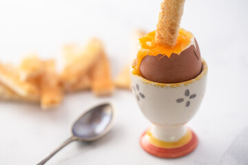 soft boiled eggs with a spoon
