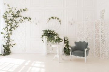luxury delicate interior of the living room and bedroom in light colors with expensive chic carved furniture in classic style