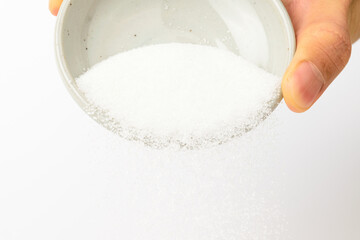 White sugar on white background