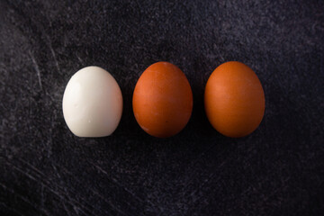 three boiled eggs, one peeled