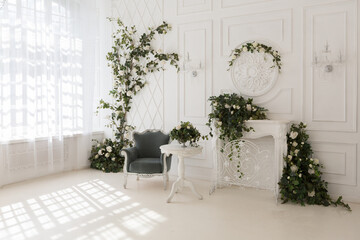 luxury delicate interior of the living room and bedroom in light colors with expensive chic carved furniture in classic style