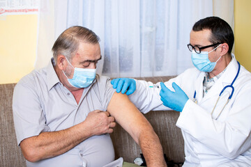 Elderly man getting coronavirus vaccine