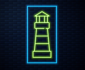 Glowing neon line Lighthouse icon isolated on brick wall background. Vector.