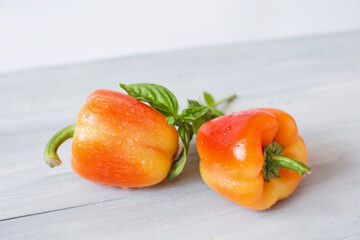 Fresh vegetables, yellow-orange peppers in drops