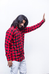 Close-up portrait of a young man pushing invisible in serious mood and stoping someone for fight