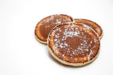 Pancakes with sugar valentine's day on white background