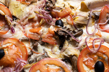 Delicious juicy pizza close-up. View from above.