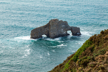 Rock formation on the cliffs of Punta da Pena Furada, surprising seascape near O Carro beach, in the Ortigueira area, in the north of Galicia, Spain.