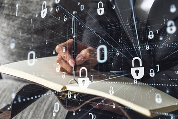 Businesswoman is taking notes of clients needs to protect cyber security from hacker attacks and...