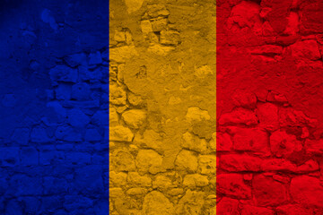 seamless panorama of the national flag of the state of Romania on an old stone wall with cracks, the concept of tourism, emigration, economy, politics, civil rights and freedoms