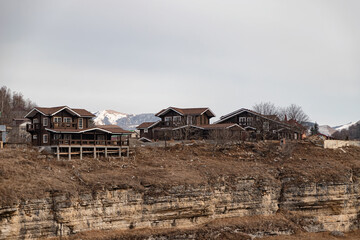 Wooden buildings of small private hotels in a mountainous area