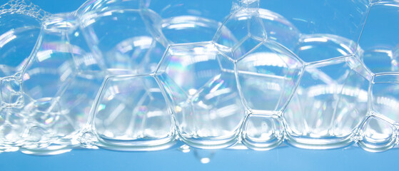 Soap bubbles on the blue background