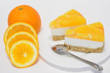 Naklejka na ściany i meble slices of orange cheesecake